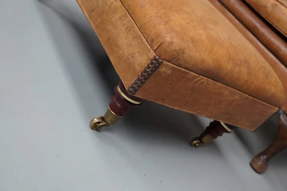 Image 1 of Vintage Nederlandse cognackleurige leren clubfauteuil met voetenbank