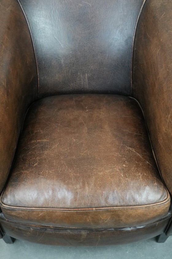 Image 1 of Sturdy and characterful vintage sheepskin club armchair