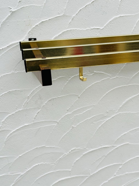 Image 1 of Vintage 1970s wooden and brass wall-mounted coat rack