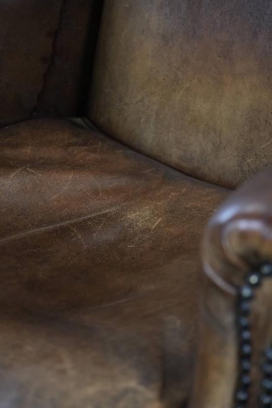 Image 1 of Comfortable vintage sheepskin wing chair with character