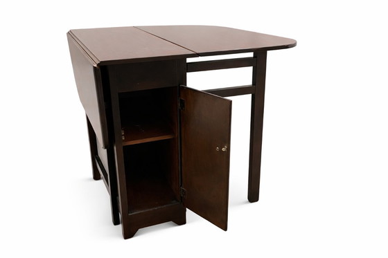 Image 1 of Tavolo pieghevole vintage con ante a ribalta – Legno scuro, circa 1950