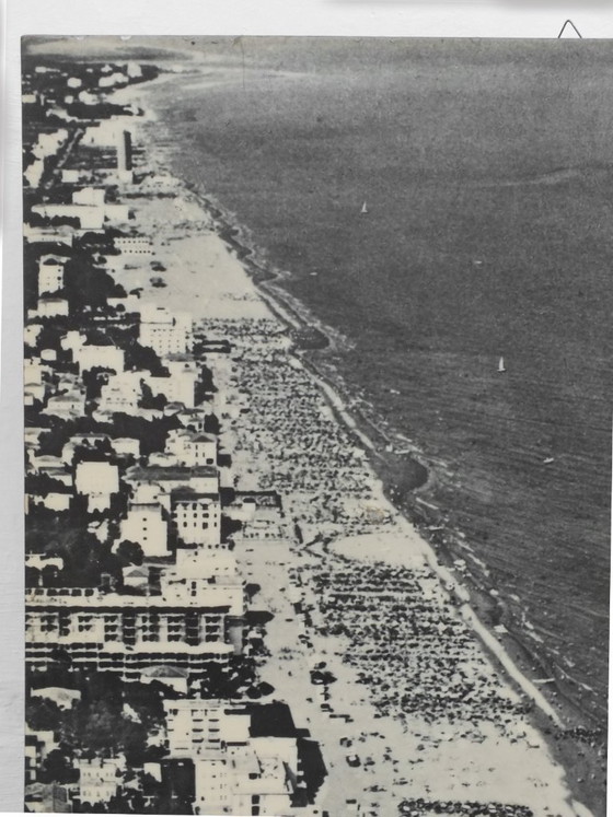 Image 1 of Cocacola umbrellas aerial photography Jesolo beach Italy years '60 by studio Ferruzzi Venice and Marco Lion photographer.