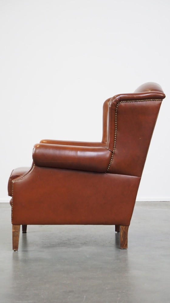 Image 1 of Fauteuil à oreilles en cuir de boeuf