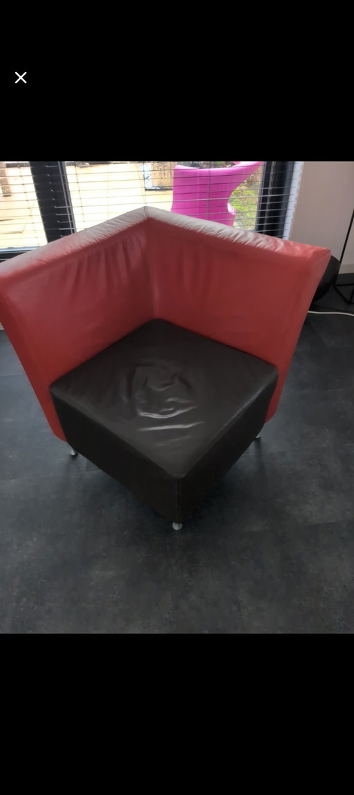 Montèl design fauteuil – rood leer met donkerbruin
