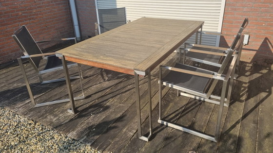 Image 1 of Set da giardino con tavolo in teak e 4 sedie in acciaio inox, realizzato in teak e textilene.