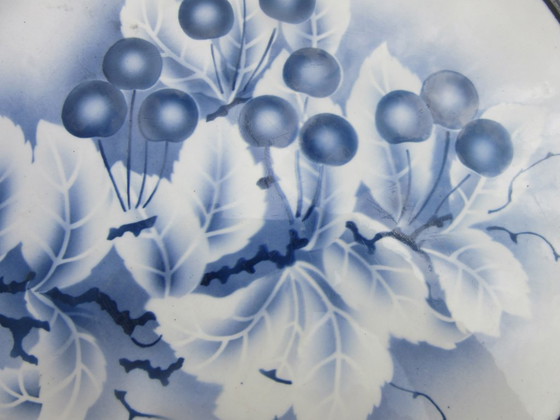 Image 1 of Vassoio rotondo vintage in ceramica e metallo, probabilmente di produzione olandese.