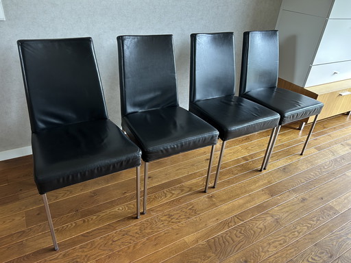 4 Black leather dining chairs