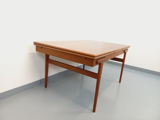 Image 1 of Vintage Scandinavian rectangular dining table by Ejvind A. Johansson from the 50s and 60s in teak with integrated extensions