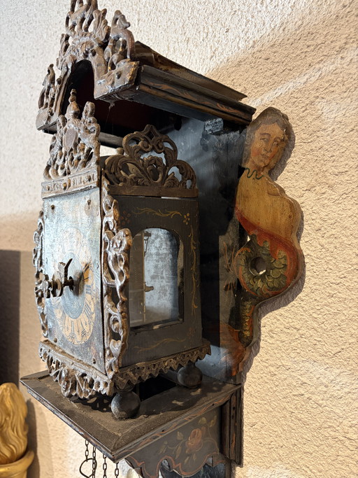 Antique grandfather clocks with a day movement and painted mermaids on the sides