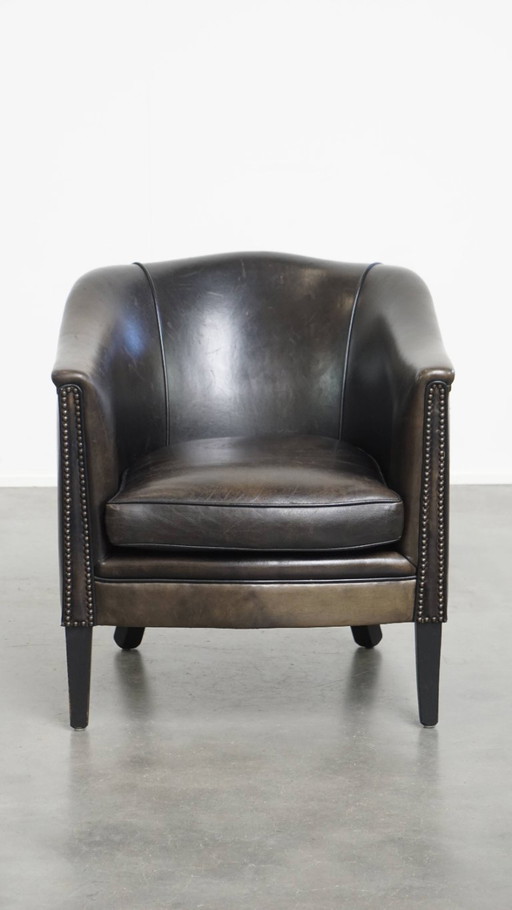  Subtiele zwart/ grijze schapenleren clubfauteuil