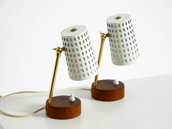 Image 1 of A pair of beautiful mid-century modern bedside lamps with perforated metal shades and teak wood bases