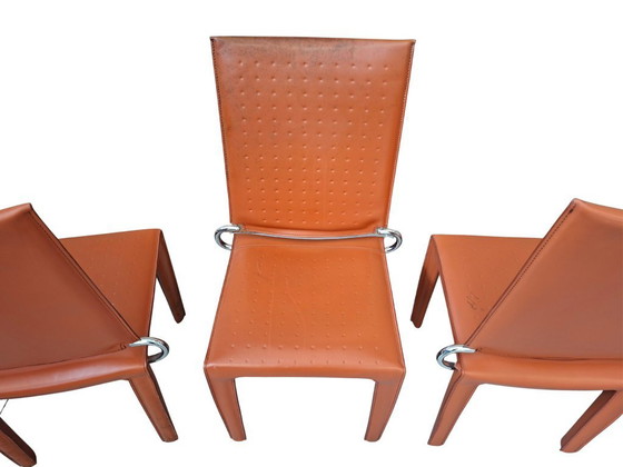 Image 1 of Set van 4 designstoelen in oranje leer en vintage ijzer.