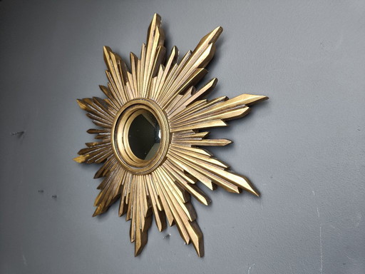Beautiful resin sunburst mirror with convex mirror glass.  The golden mirror is in a good condition.  1960s - made in Belgium.  