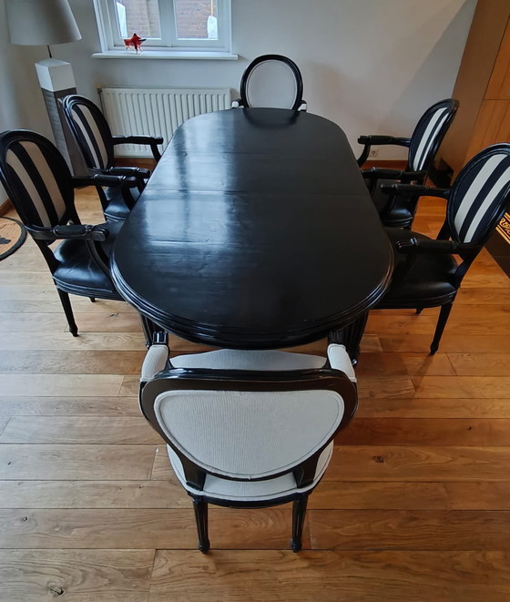 Image 1 of Table de salle à manger ovale noire avec 6 chaises