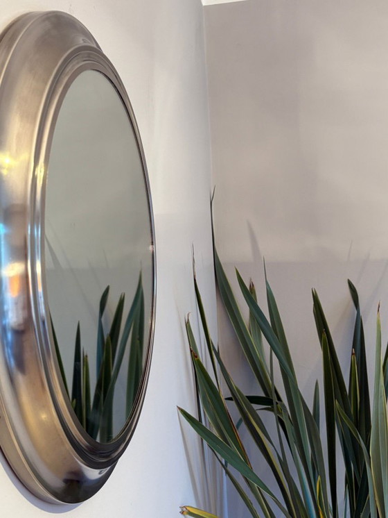 Image 1 of round mirror with metal frame, dating back to the 1970s
