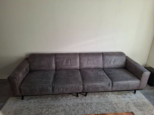 ¡Hermoso sofá de 4 plazas y reposapiés en ecopiel, gris oscuro!