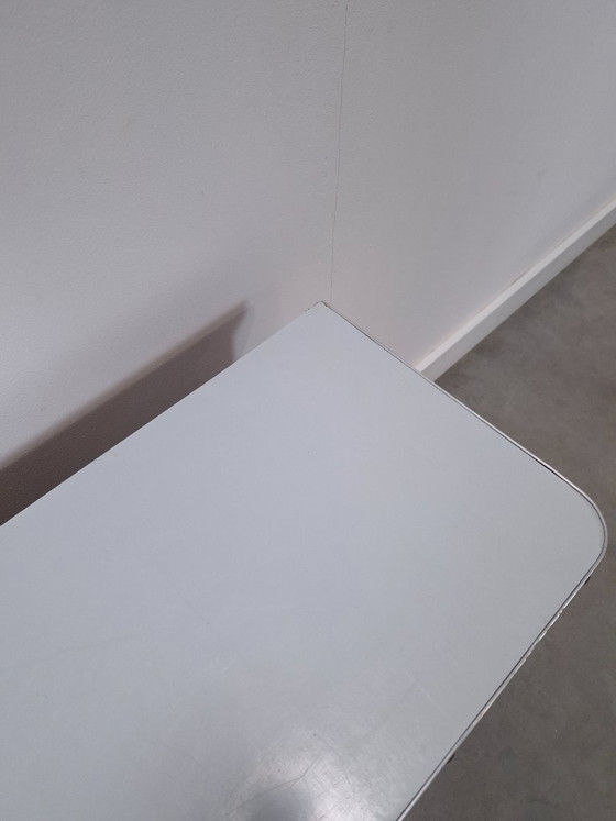 Image 1 of 1950s light blue-yellow cabinet with Formica and slanted legs