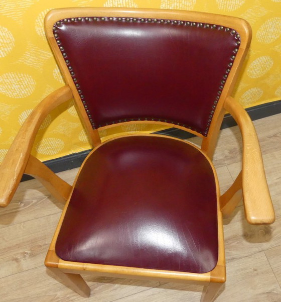 Image 1 of Armchair upholstered spring core skai leather oxblood decorative rivets office chair 60s retro