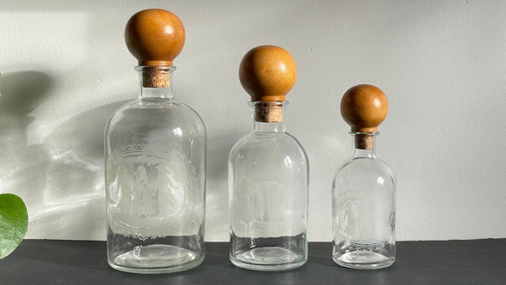 Image 1 of Vintage Engraved Glass and Wood Bottles