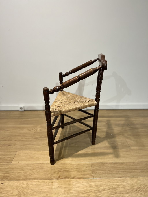 Antique wicker chair three legged