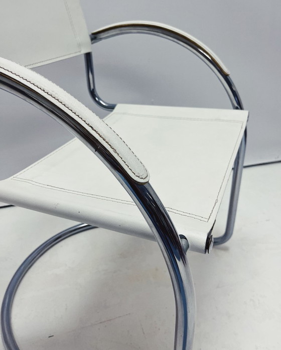 Image 1 of Vintage tubular frame chairs with white skai