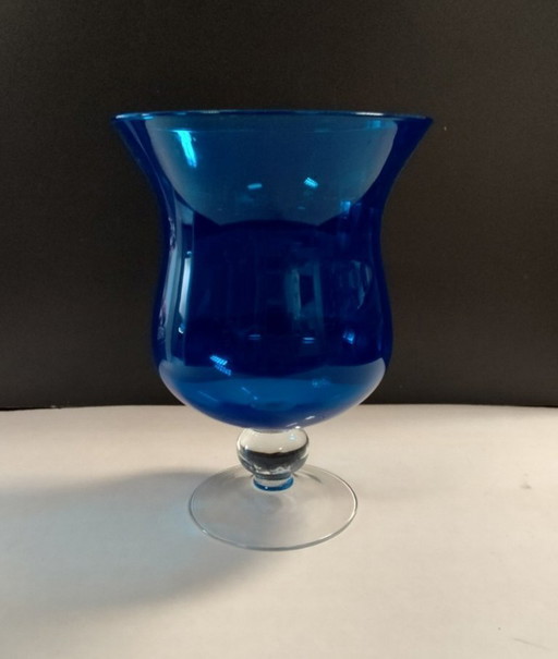 Blue glass vase on foot