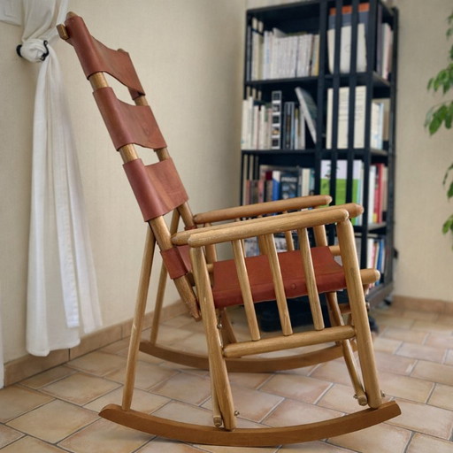 Handcrafted folding rocking chair made of solid wood and natural leather