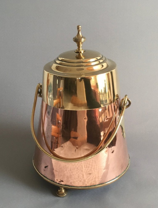 Red copper extinguishing pot with yellow copper lid and handle