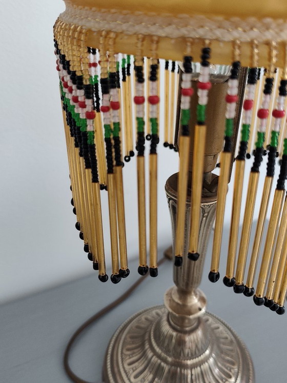 Image 1 of Antieke gouden tafellamp met kwastjes