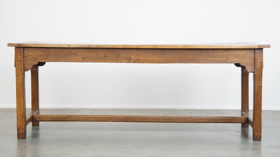 Image 1 of Large antique French farmhouse dining table made of fruitwood from the late 18th century with beautiful and original details.