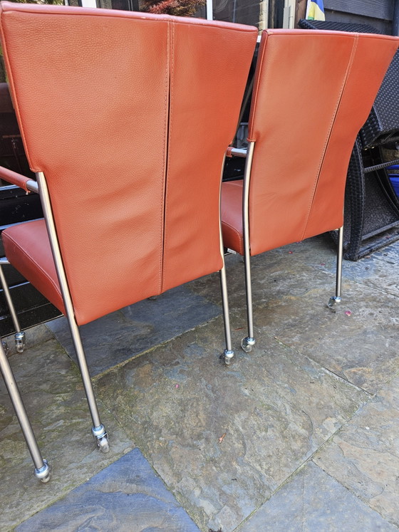 Image 1 of 4 red leather dining chairs on wheels, brand Bert Plantagie