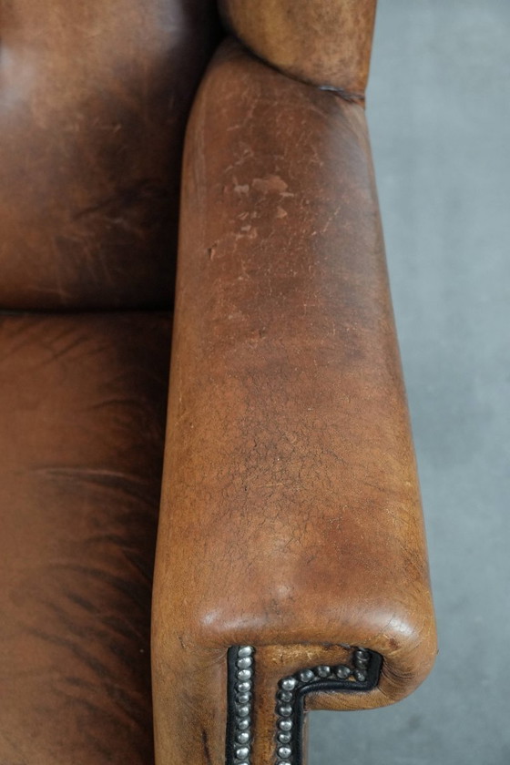 Image 1 of Sheepskin wing chair with a characterful appearance