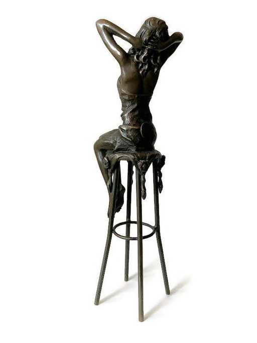 Bronze lady on chair