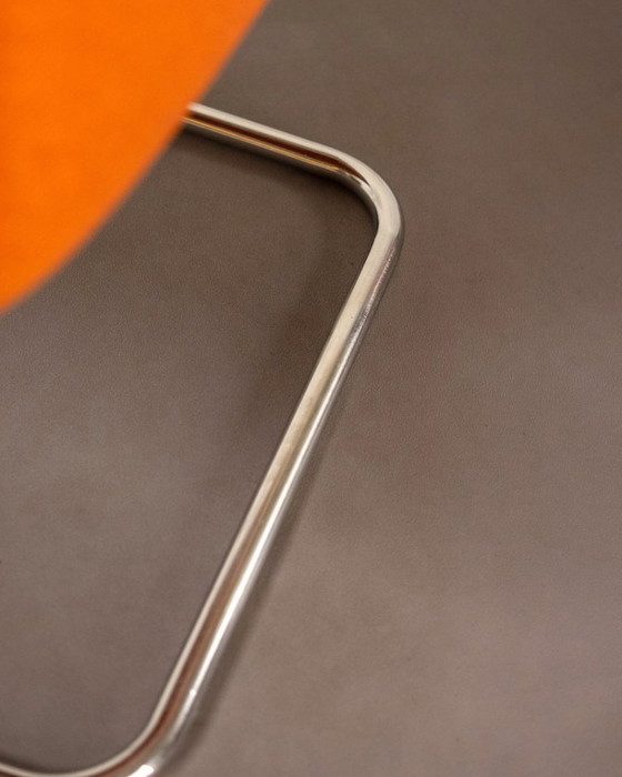 Image 1 of Fauteuil luge en acier tubulaire et tapisserie orange, Allemagne, années 1980