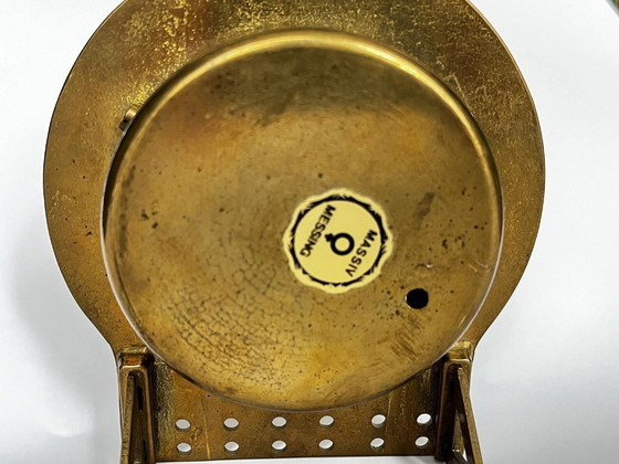 Image 1 of Mid-century brutalist brass zodiac desk clock met datumkalender – 1960s West Germany