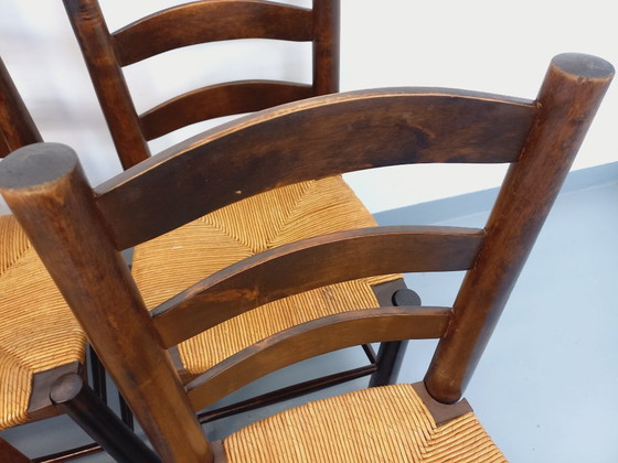 Image 1 of Set van 6 vintage brutalistische stoelen van Georges Robert, gemaakt van hout en stro, uit de jaren 50 en 60.