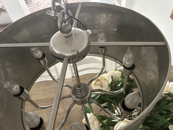 Image 1 of Lampada a sospensione con paralume cilindrico color argento e catena dimmerabile.