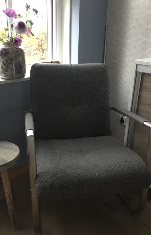 Brown armchair with cream leather accents by Henders and Hazel