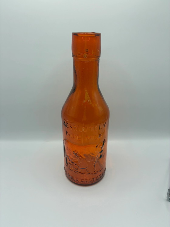 Antike bernsteinfarbene Milchflasche „Absolut reine Milch“ – Der Milchbeschützer – um 1900 (photo 2 of 6)