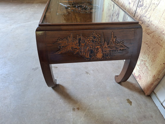 Image 1 of Antique Asian coffee table with beautiful wood carving, dimensions: 100x45cm and 41cm high.