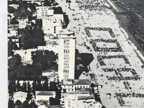 Image 1 of Cocacola umbrellas aerial photography Jesolo beach Italy years '60 by studio Ferruzzi Venice and Marco Lion photographer.