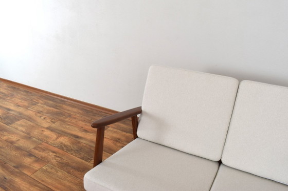 Image 1 of Zweisitzer-Sofa aus dänischem Teakholz aus der Mitte des 20. Jahrhunderts, 1960er Jahre.