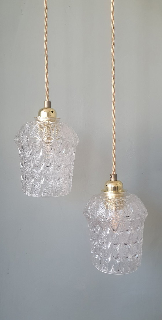 Image 1 of Set of two vintage Mic Century pendant lamps of thick, textured glass.