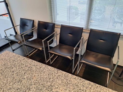 Black leather Arco Frame dining chairs