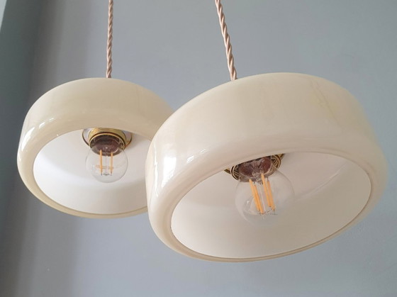 Image 1 of Vintage pendant lamp set (2) of yellow pastel opaline glass. Art Deco design.