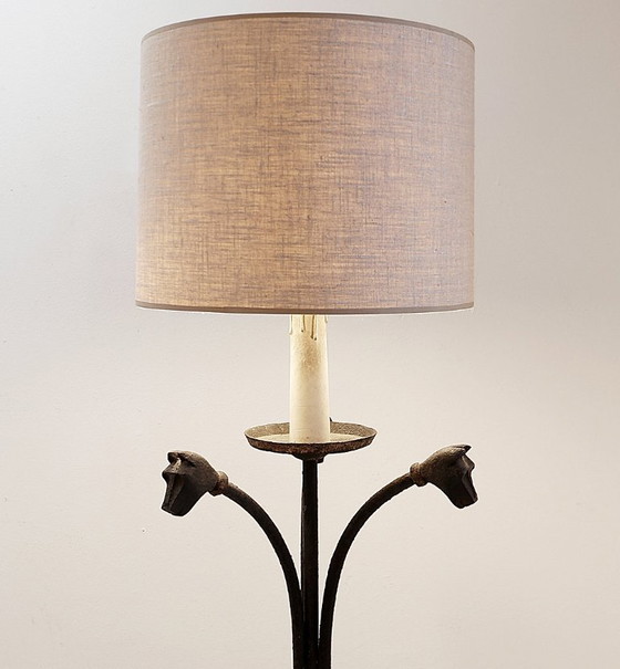 Image 1 of Wrought-iron tripod floor lamp adorned with stylized animal heads