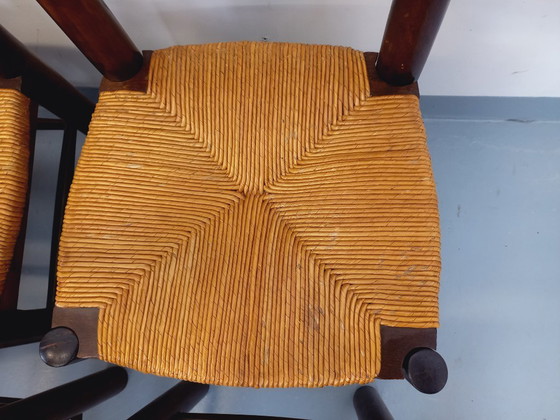 Image 1 of Set van 6 vintage brutalistische stoelen van Georges Robert, gemaakt van hout en stro, uit de jaren 50 en 60.