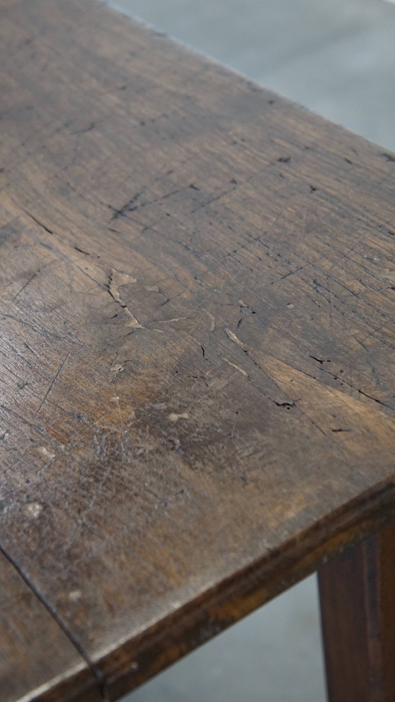 Image 1 of Antique early 19th century French dining table made of oak with 1 drawer