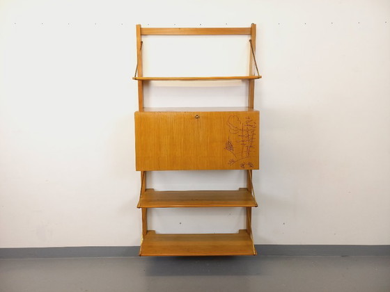 Image 1 of Wall-mounted bookcase with vintage light wood and brass secretary bar, dating from the 1960s