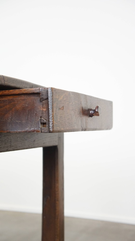 Image 1 of Antique early 19th century French dining table made of oak with 1 drawer